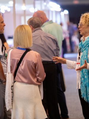 Cindy Chandler, creator of the Atlanta Jewelry Show education programs, converses with attendees in the aisles