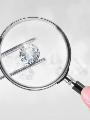 Diamond shown through a magnifying glass